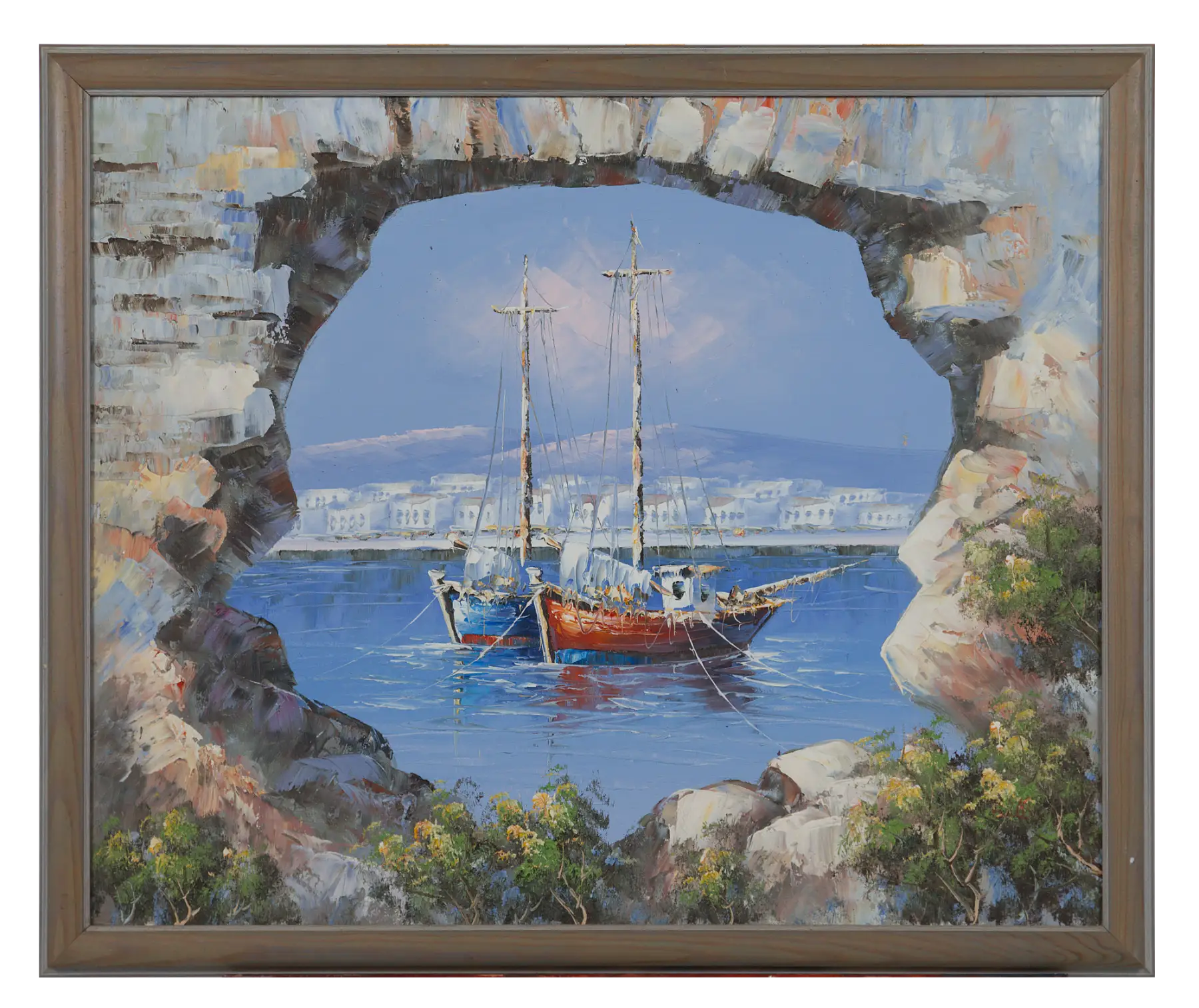 A view through a stone arch onto a blue harbour with two masted boats moored, a white village on the far shore